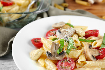 Plate with delicious roasted turkey tetrazzini on table