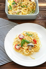 Plate with delicious roasted turkey tetrazzini on table