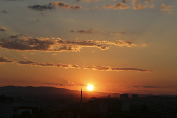 Naklejka premium Sunset over Ankara Turkey skies. beautiful landscape with a red sunset sky over the field