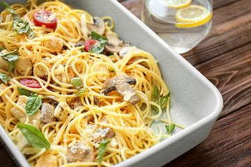 Delicious roasted turkey tetrazzini in baking dish on table