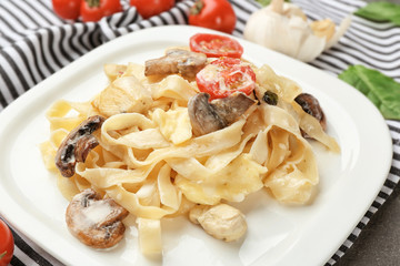 Plate with delicious turkey tetrazzini on napkin, close up