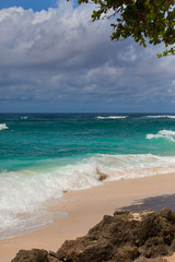 Indian ocean texture. Turquoise sea water with white foam and big wave. Powerful and peaceful nature concept.