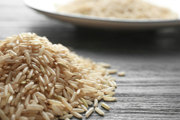 Pile of long grain brown rice on table