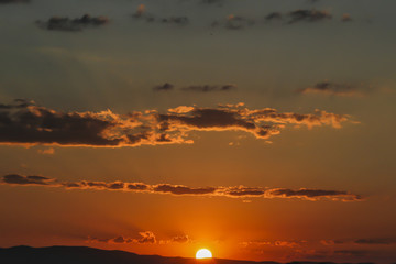 Naklejka premium Sunset over Ankara Turkey skies. beautiful landscape with a red sunset sky over the field