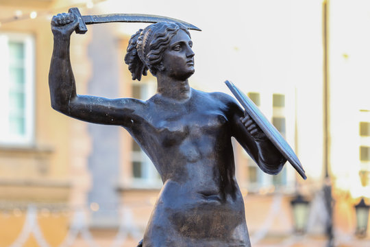 Historical statue of Mermaid of Warsaw (1855), Polish symbol and protector of Warsaw city in the Old Town Market Square, close up