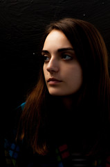 a young beautiful girl looking thoughtfully, cute portrait