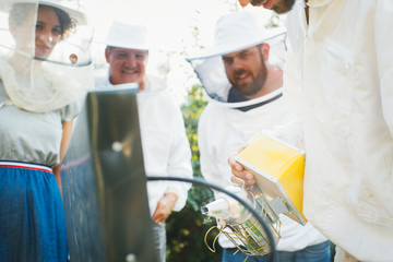 Apiculture Workshop - Apiarist Explaining to Students How To Use Bee Smoker