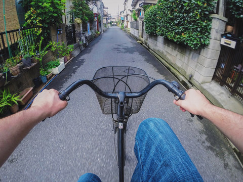 Riding A Bicycle On A Small Japanese Road