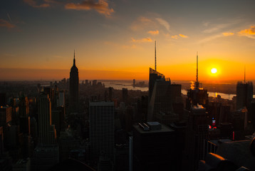 Fototapeta na wymiar New York City skyline with urban skyscrapers at sunset.