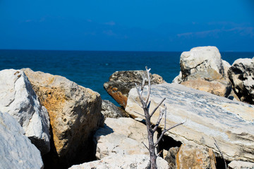 white rocks against a turquoise sky on a hot sunny day