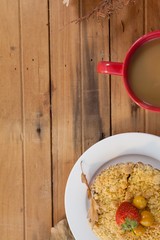 Breakfast plate with coffee mug on table