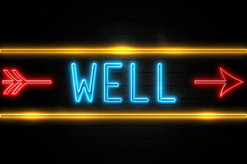 Obraz premium Well - fluorescent Neon Sign on brickwall Front view