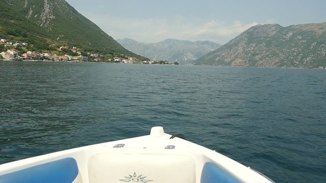 Adventure background. Marine landscape with boat going forward on sea bay. Surf boat. Slow motion.