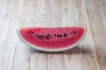 Fresh sliced watermelon on wooden background