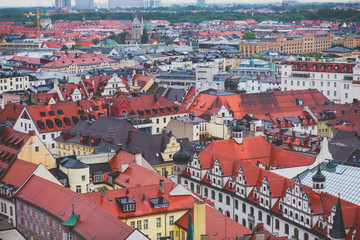 Fototapeta na wymiar Beautiful super wide-angle sunny aerial view of Munich, Bayern, Bavaria, Germany with skyline and scenery beyond the city, seen from the observation deck of St. Peter Church