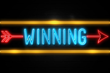 Winning  - fluorescent Neon Sign on brickwall Front view