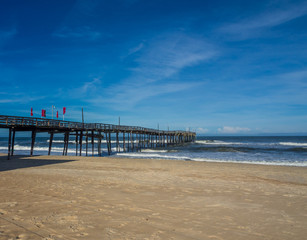 Fishing pier at the sandy beach