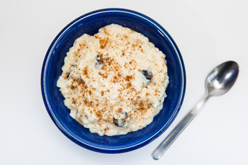 Rice Pudding with cinnamon and raisins preparation : Ready served sweet rice pudding