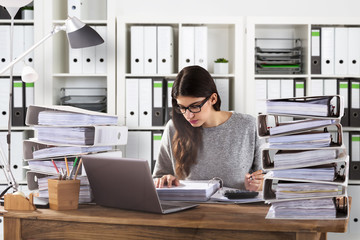 Businesswoman Calculating Bill