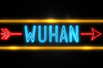 Obraz premium Wuhan - fluorescent Neon Sign on brickwall Front view