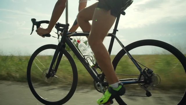 Handsome cyclist riding bike single track green route sunrise rapid slow motion