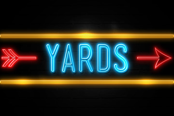 Yards  - fluorescent Neon Sign on brickwall Front view