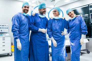 Successful surgeon team standing in operating room