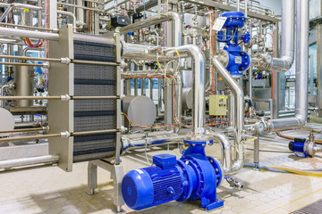metalic plate in heat exchange machine and pump in the food industrial plant
