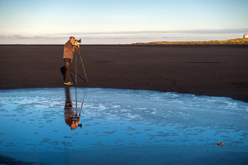 Photographer in Stokksnes beach