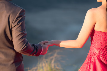 Young married people holding hand each other, Pre-wedding at Semeru national park, Mount Bromo, East Java, Indonesia