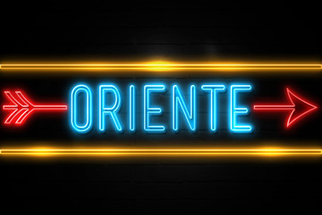 Oriente  - fluorescent Neon Sign on brickwall Front view