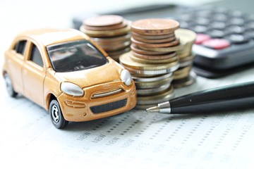 Business, finance, saving money or car loan concept : Miniature car model, coins stack, calculator...