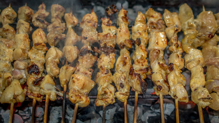 traditional indonesian cuisine chicken satay; chicken skewer with bamboo stick grilled on charcoal