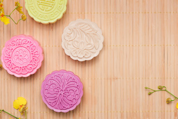 Asian, Japanian food, Traditional sweet dessert multicolored no bake snow skin mooncakes on white marble table. copy space top view