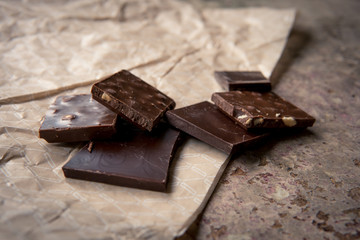 Dark chocolate stack with hazelnuts. Sweet dessert
