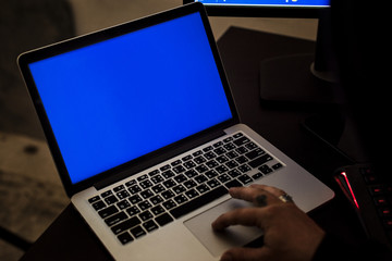 Hacker using a laptop hacking