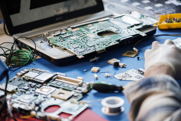 Technicians working on computer mainboard