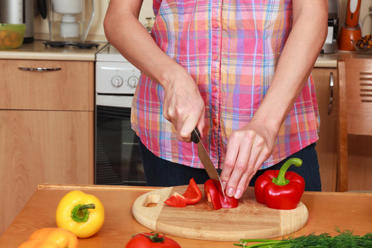 Closeup shot of a woman preparing a salad