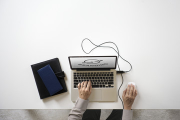 Hands working on a laptop