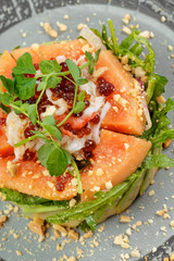 Citrus green salad with salmon, grapefruit and avocado.