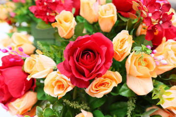Colorful artificial roses flowers.