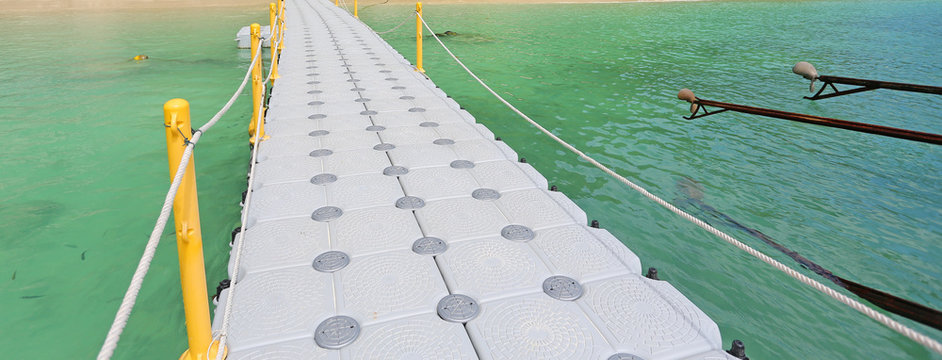 floating footpath in the sea for go to the beach.