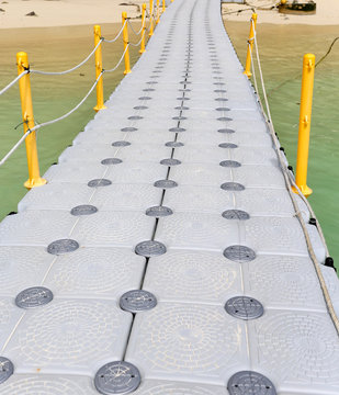 floating footpath in the sea for go to the beach.