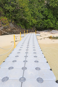 floating footpath in the sea for go to the beach.
