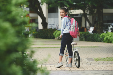 Girl with bicycle