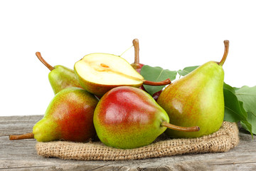pear with leaf on old wooden table with white background