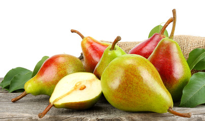 pear with leaf on old wooden table with white background