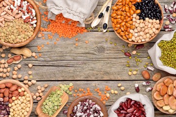 Various dry legumes on a wooden table. Copyspace background.Top view.