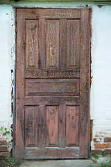 The old door with cracked paint background