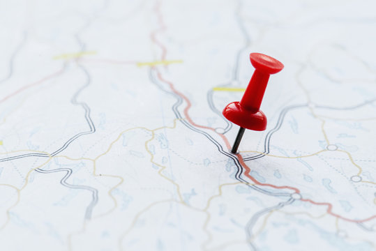 Closeup of pushpin showing the location on the map